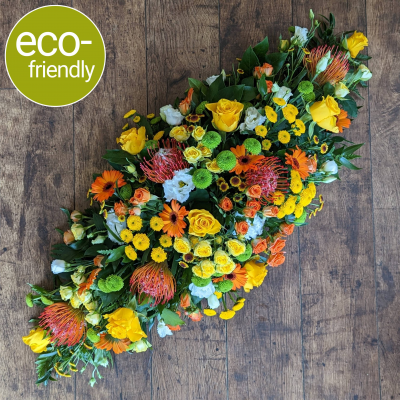 Eco-Double Ended Bright Coffin Spray, eco-friendly funeral flowers - A bright double ended funeral spray, sometimes called a coffin spray (to sit on top of the coffin), beautifully arranged in biodegradable floral foam. Eco-friendly funeral flowers