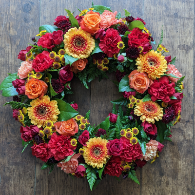 Mixed Vibrant Funeral Wreath, fresh flowers, delivered in Darlington - Our Mixed Vibrant Funeral Wreath includes roses, chrysanthemum, carnations and germini. Fresh funeral arrangement Delivered in Darlington. Funeral florist, eco-friendly